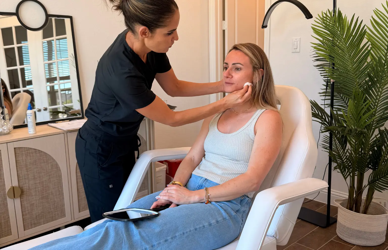 Taliah personally assessing a client at Tula Tu Aesthetics in The Woodlands, TX